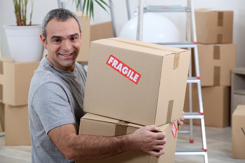 Professional packing team preparing household boxes in Ilford