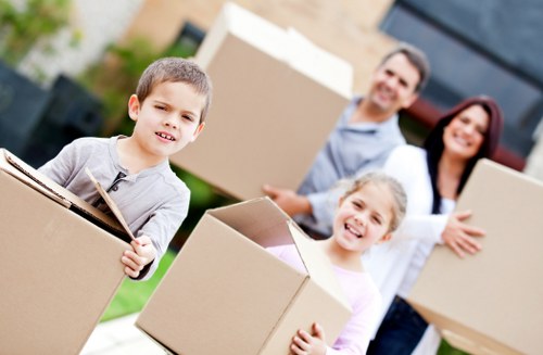 Careful loading of household items for a flat move in Ilford