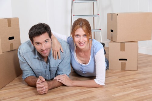 Local removals team handling furniture in an Ilford property