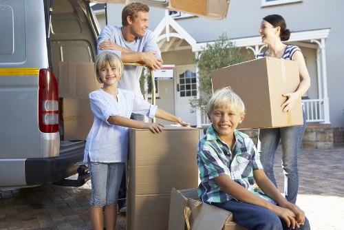 Professional movers loading household items for a local Ilford relocation