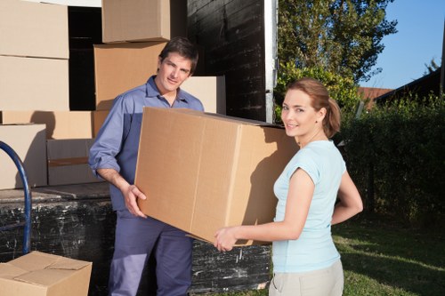 Packed moving boxes and furniture prepared for a removals job in Ilford